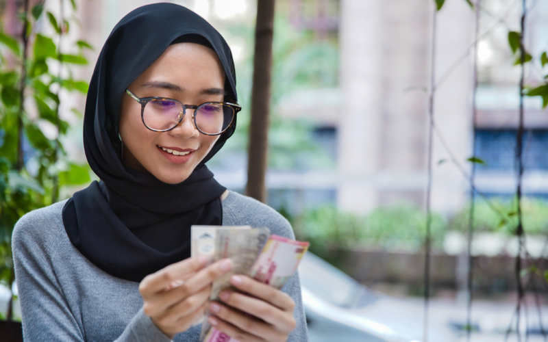 Woman counting banknotes